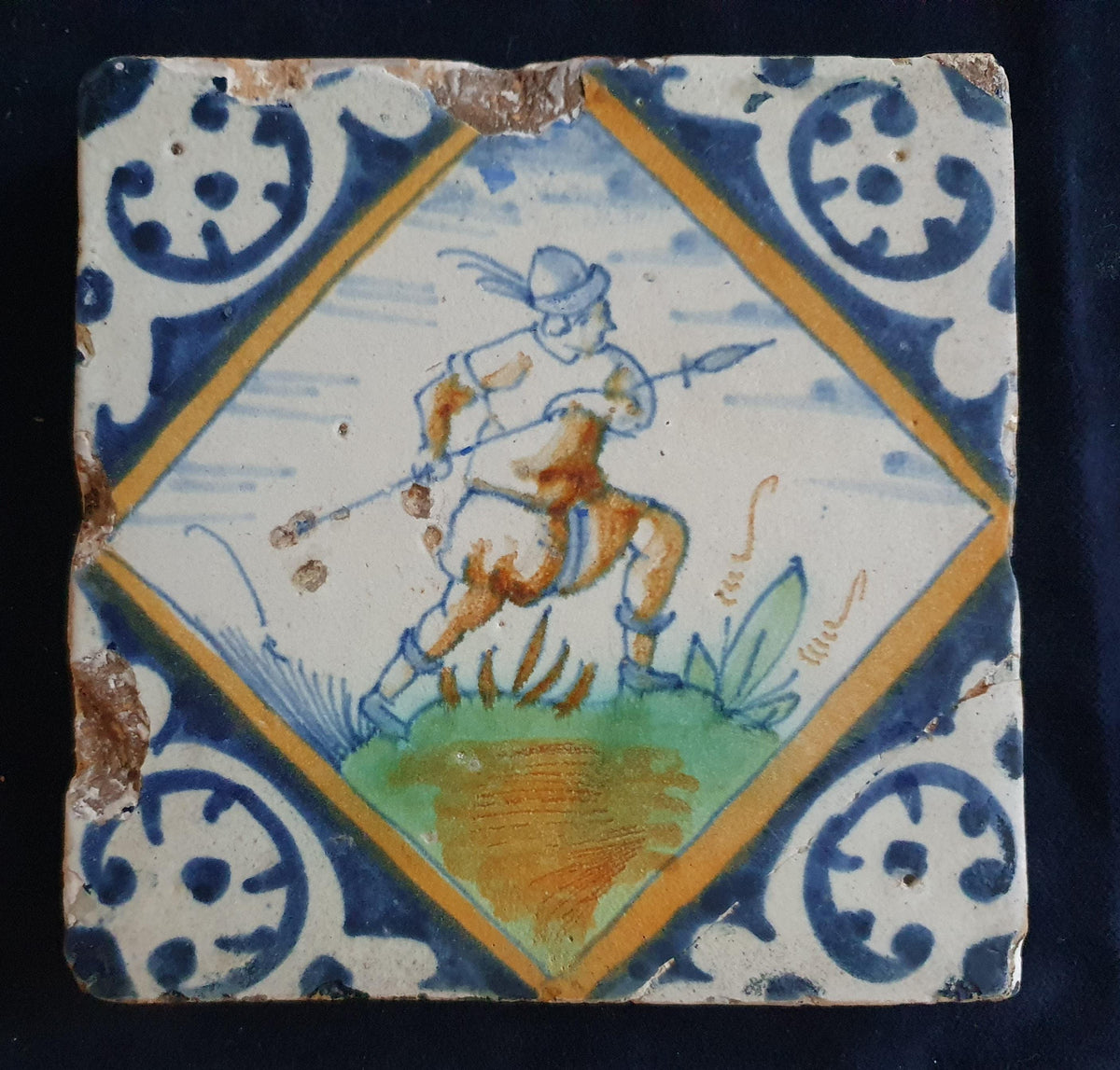 Early 17th-century (c. 1620) Delft square tile, polychrome-painted and depicting a soldier with a spear. Figuretile