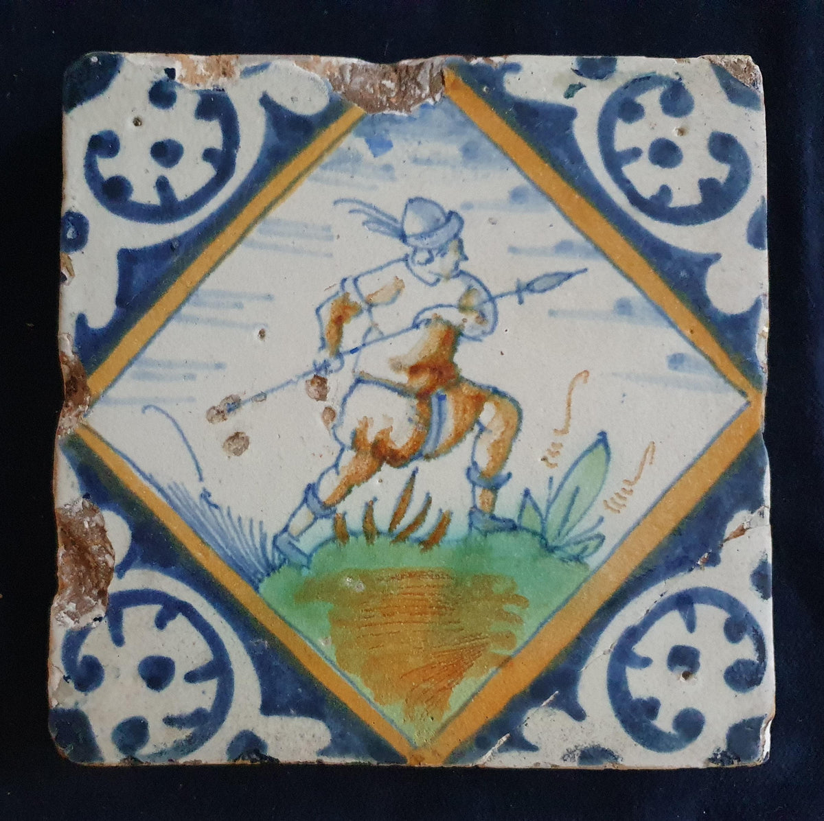 Early 17th-century (c. 1620) Delft square tile, polychrome-painted and depicting a soldier with a spear. Figuretile