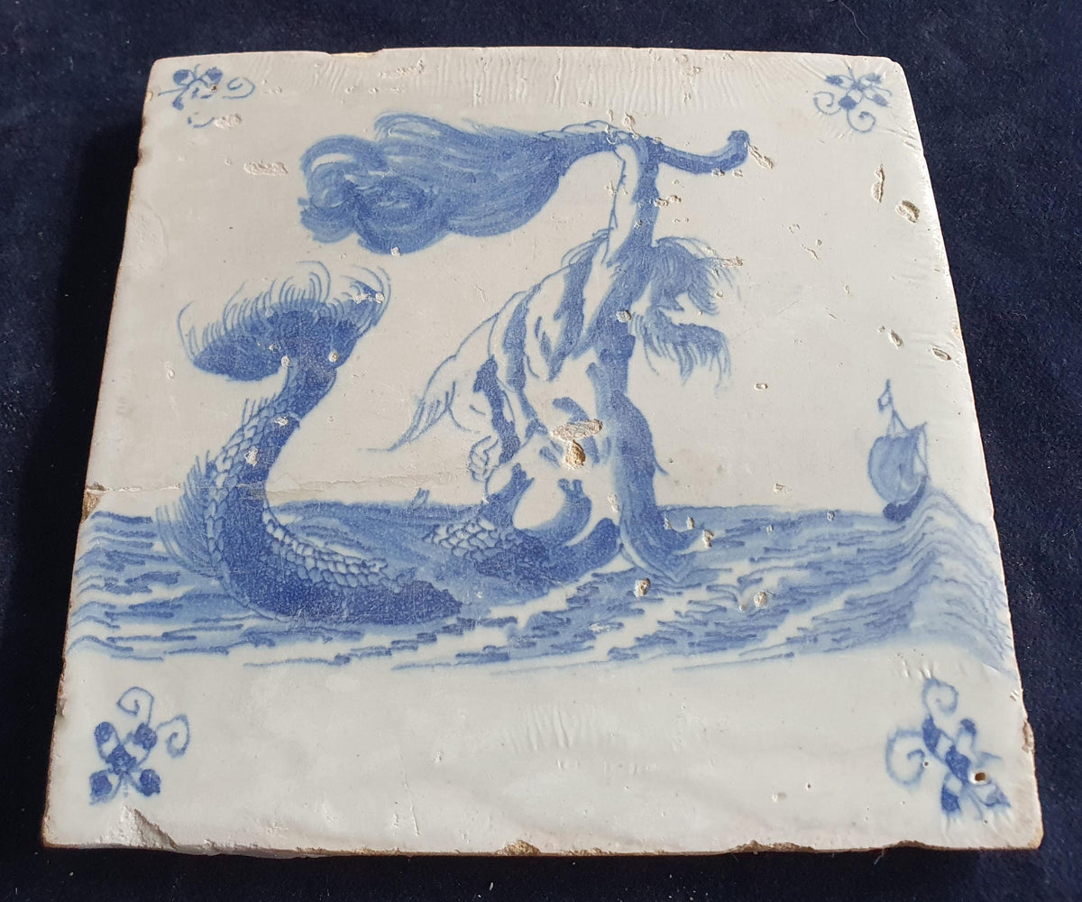 This antique Delft seacreature tile depicts a fierce-looking merman. around 1660 mythicaltile