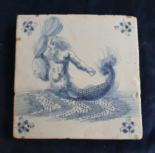 Antique Delft tile depicts a fierce-looking sailor holding a burning po. around 1660 mythicaltile