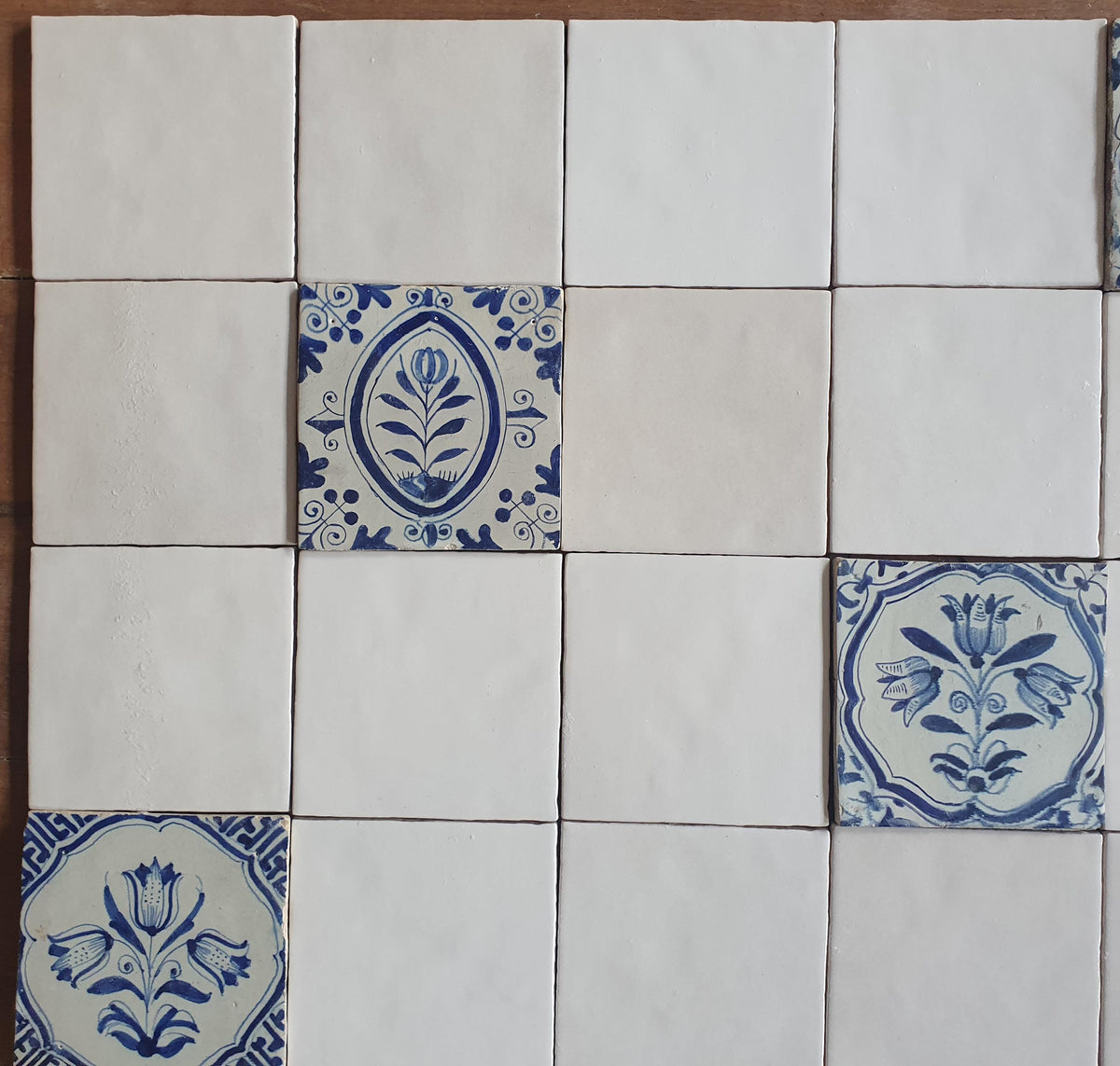 40 tiles, including 8 from the 17th century.  Wall tiles