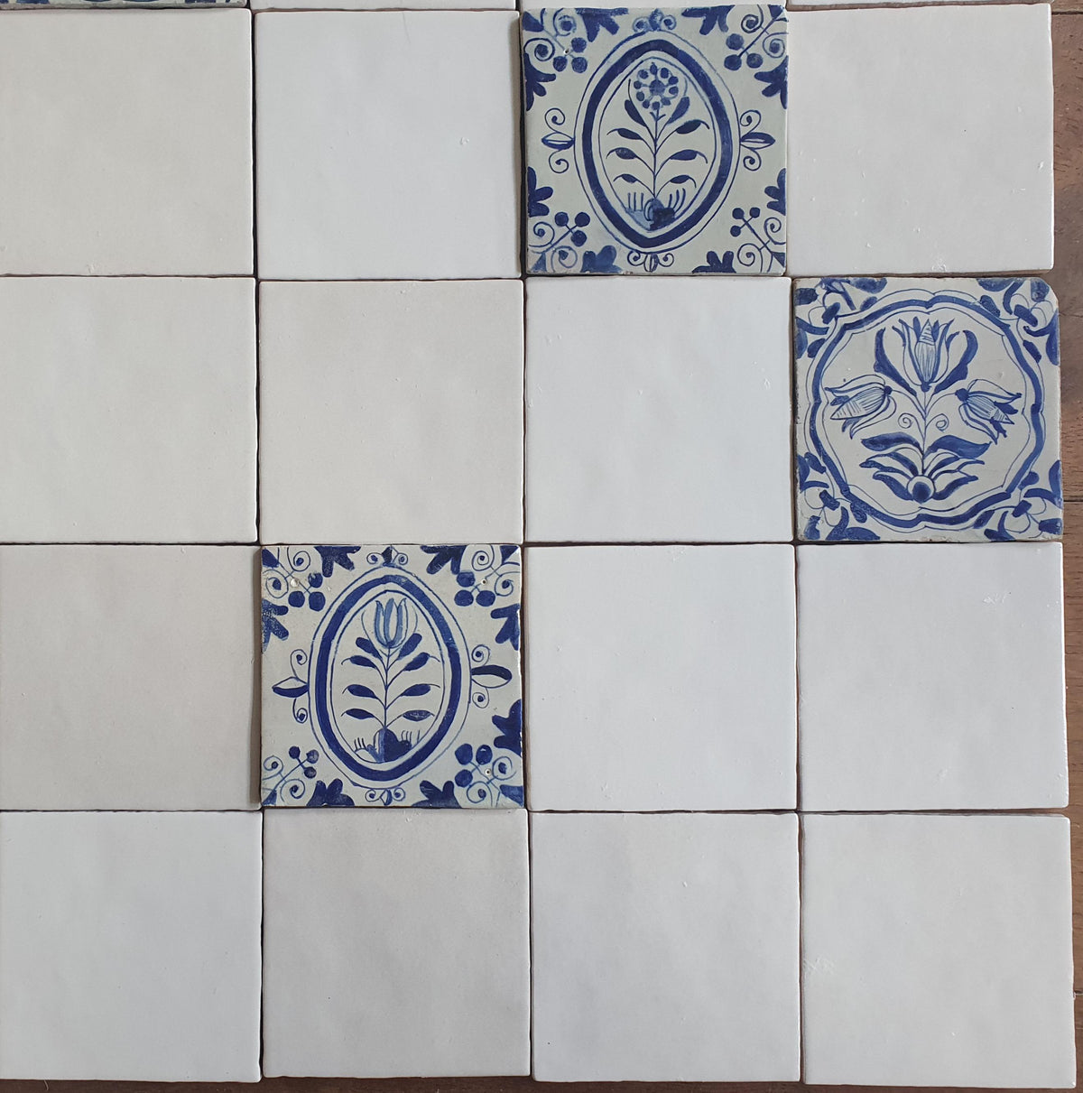 40 tiles, including 8 from the 17th century.  Wall tiles