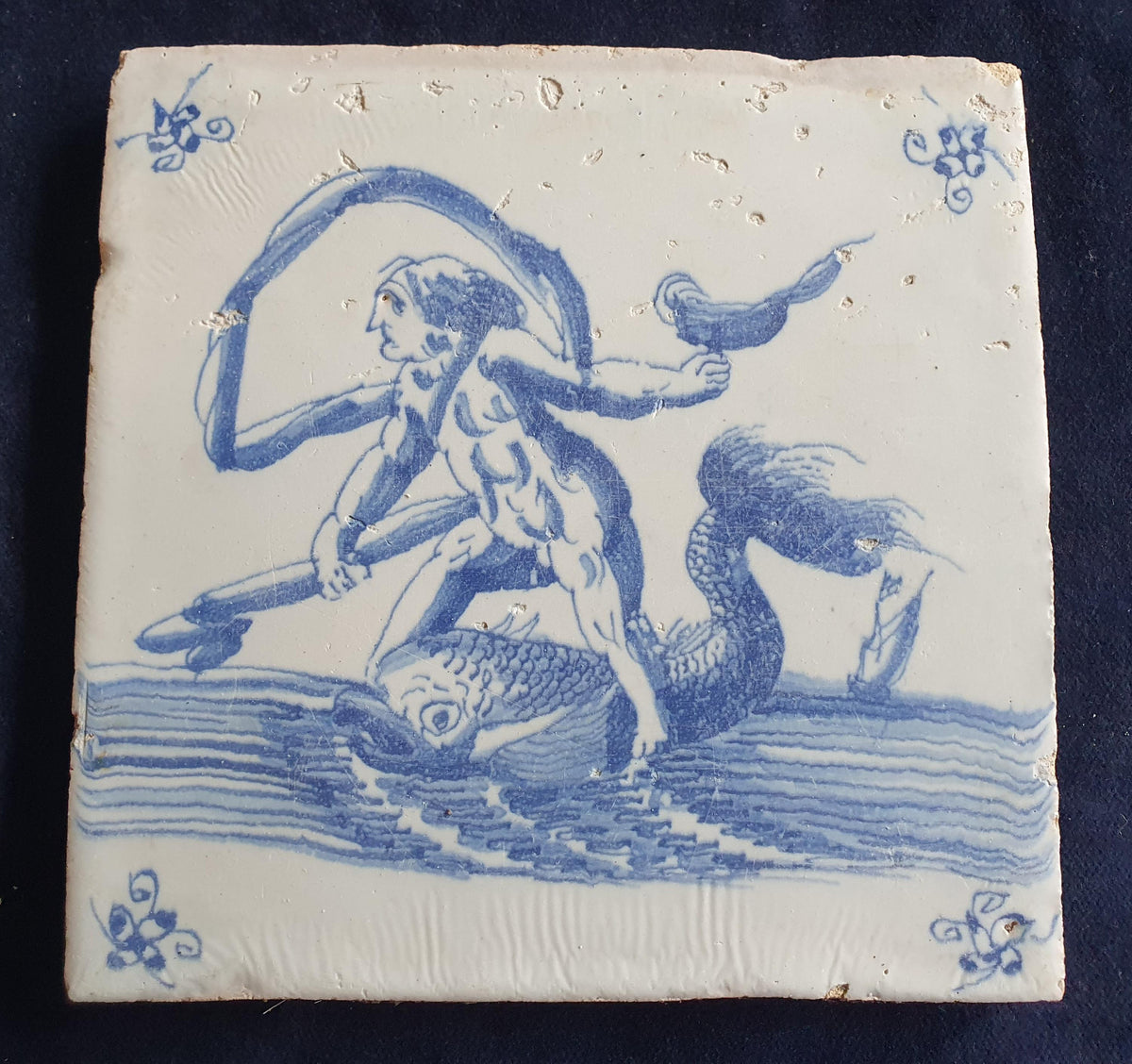 Delft tile with  a merman was produced around 1660 .  mythicaltile