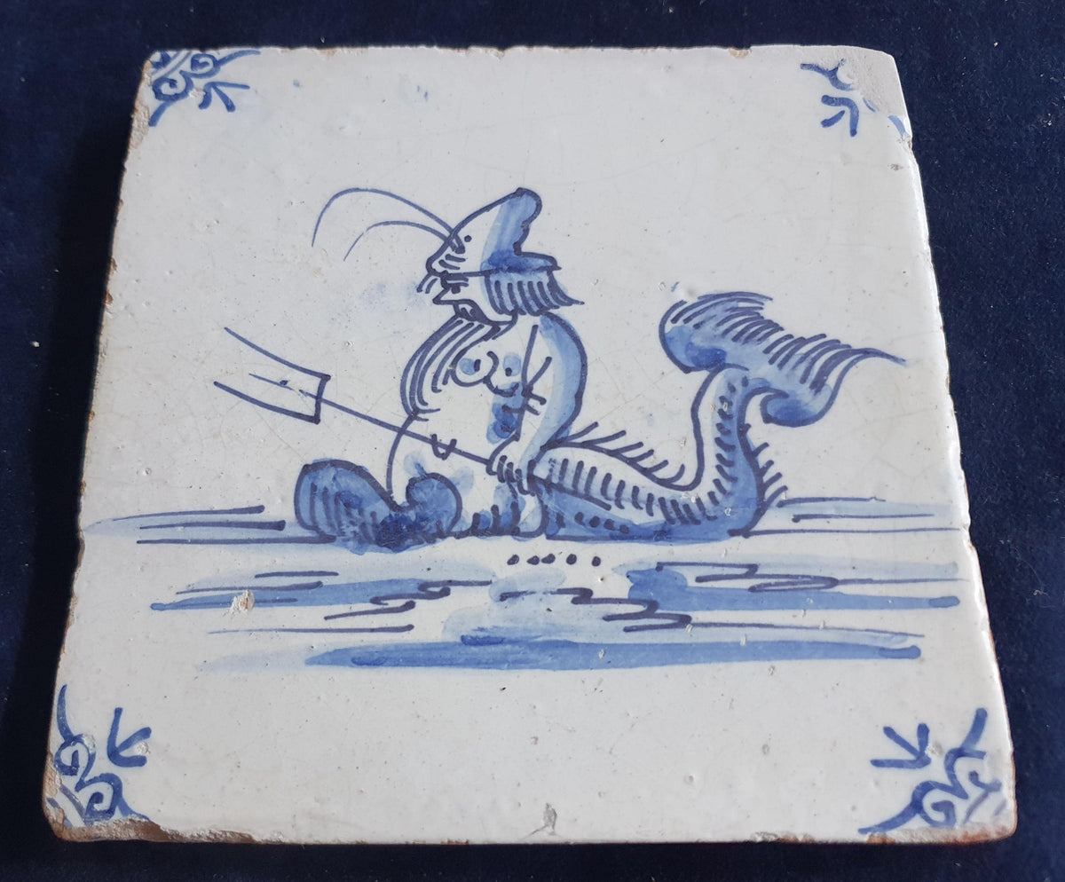Delft tile with  a merman was produced around 1660 .  mythicaltile
