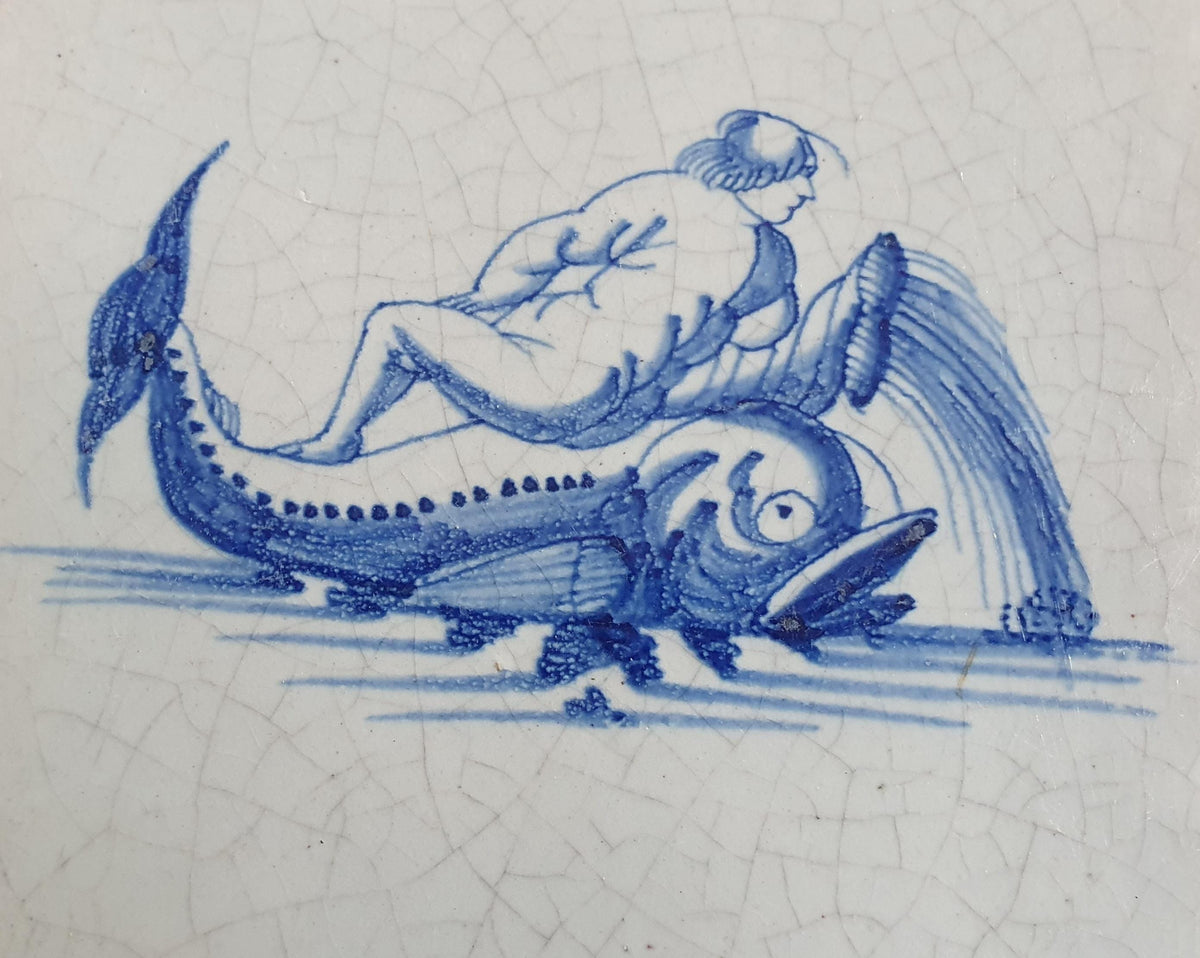 Delft tile depicts putti on top of dolphin. around 1660 mythicaltile
