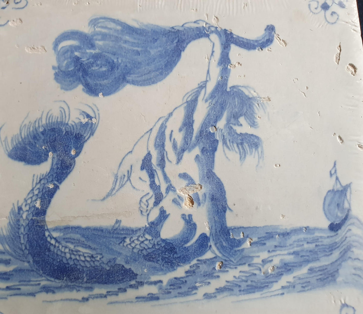 This antique Delft seacreature tile depicts a fierce-looking merman. around 1660 mythicaltile