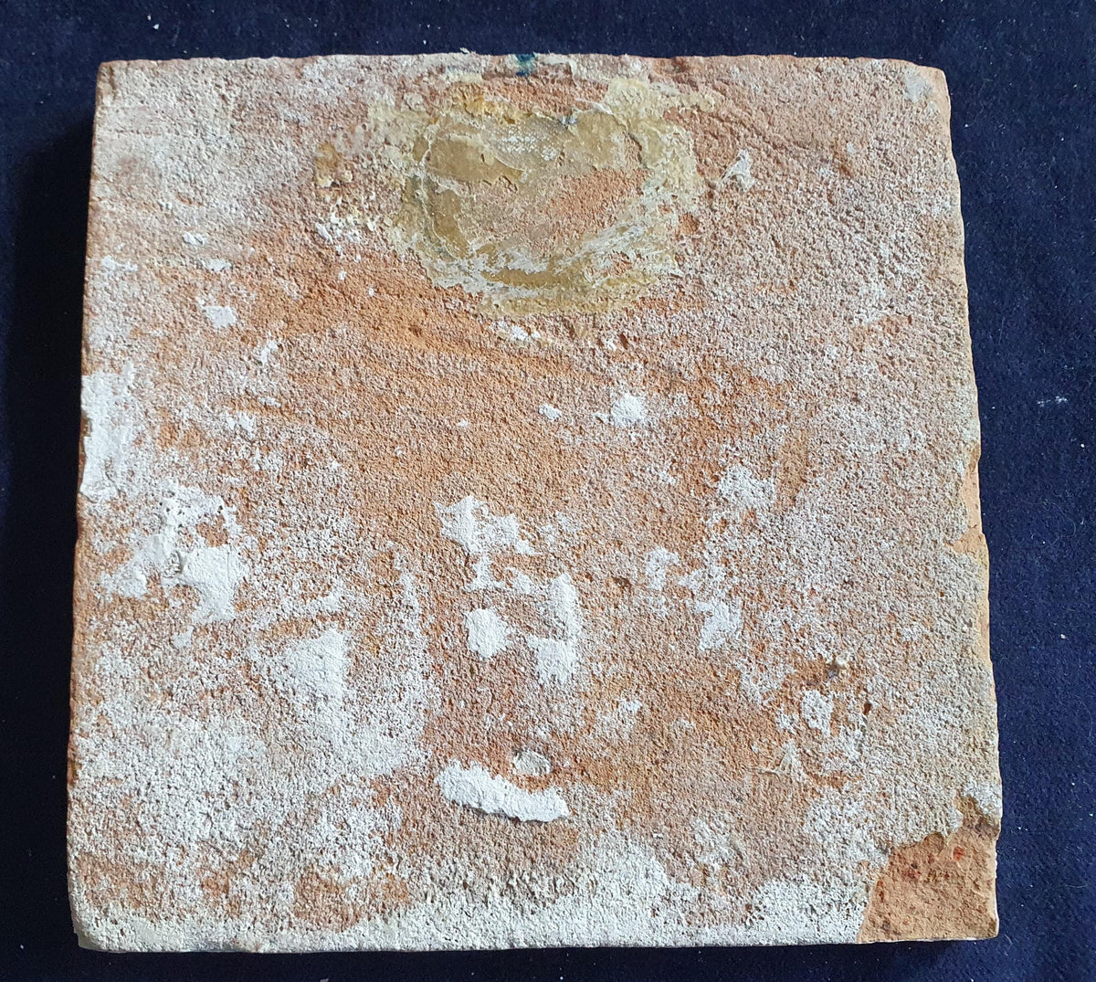 Antique Delft tile, dating from around 1650, depicts a man spitting. Figuretile