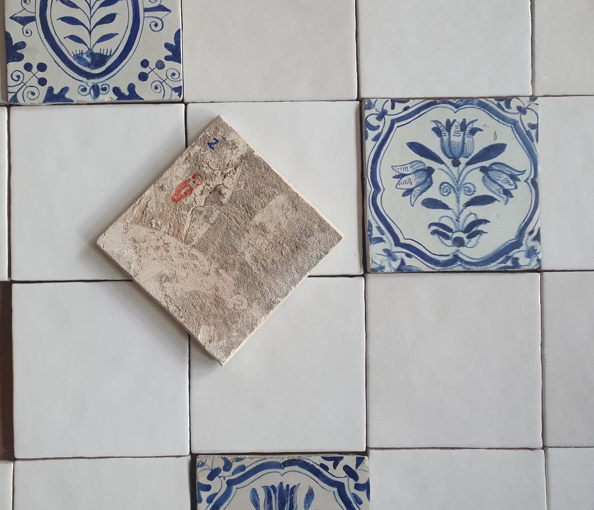 40 tiles, including 8 from the 17th century.  Wall tiles