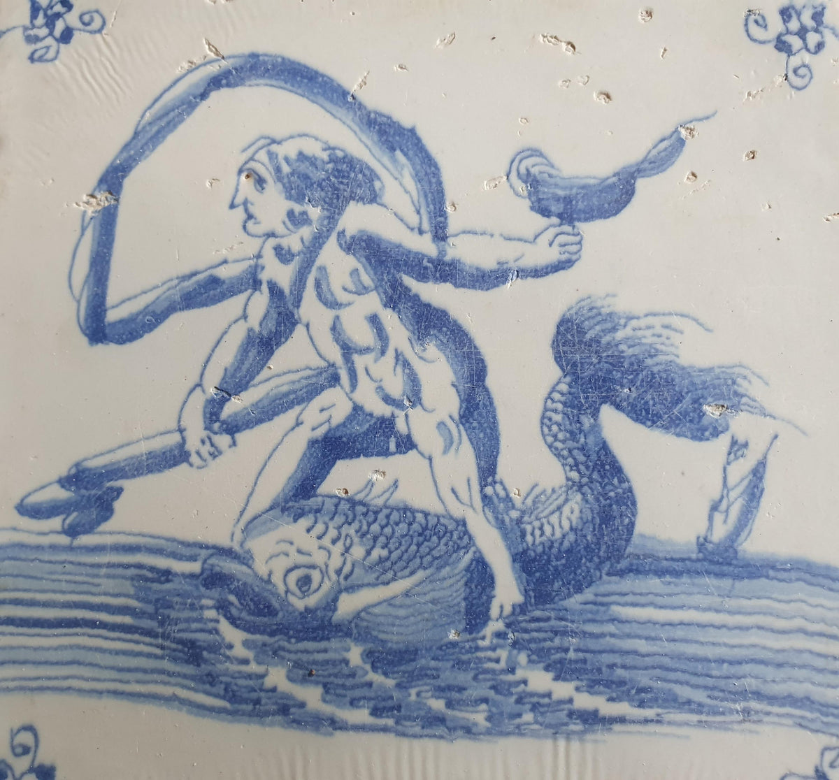 Delft tile with  a merman was produced around 1660 .  mythicaltile
