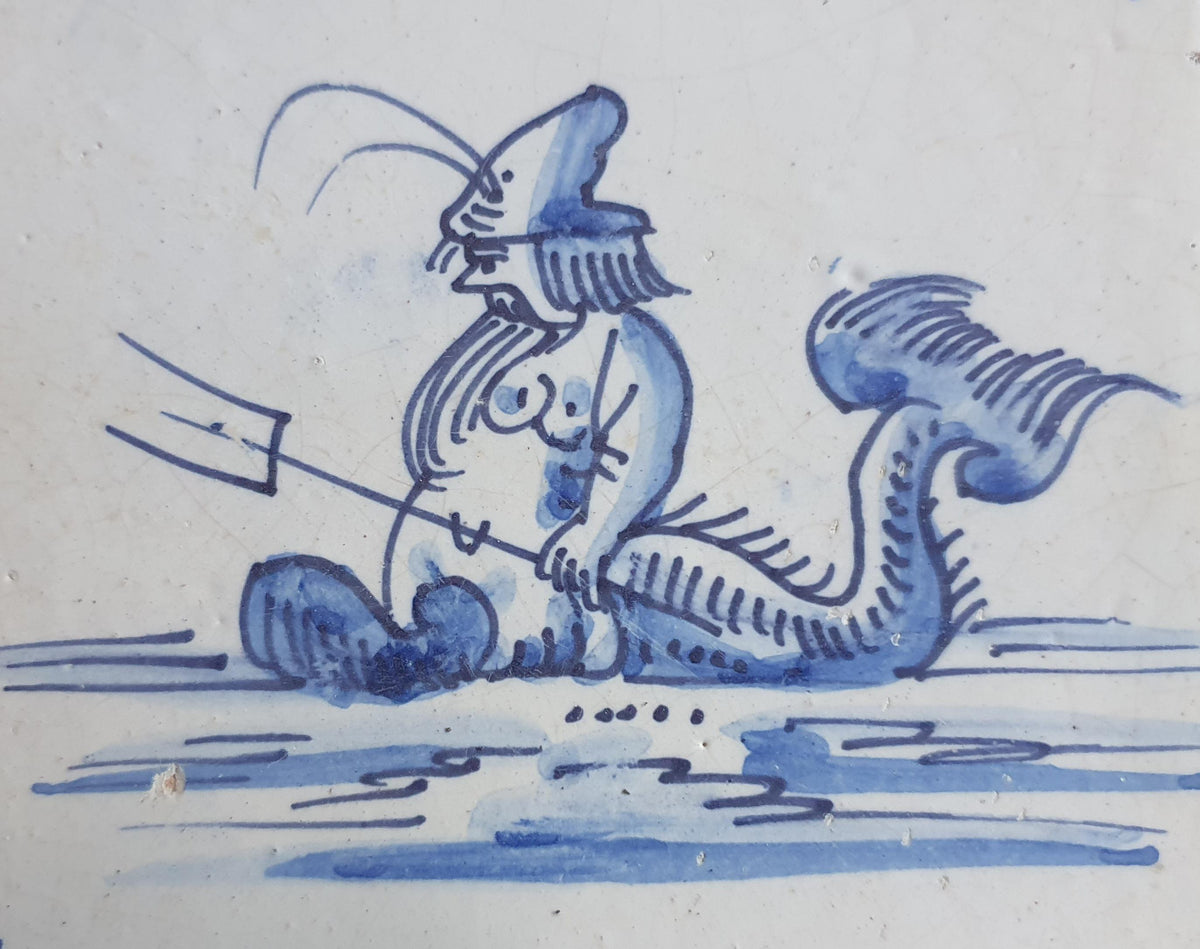 Delft tile with  a merman was produced around 1660 .  mythicaltile