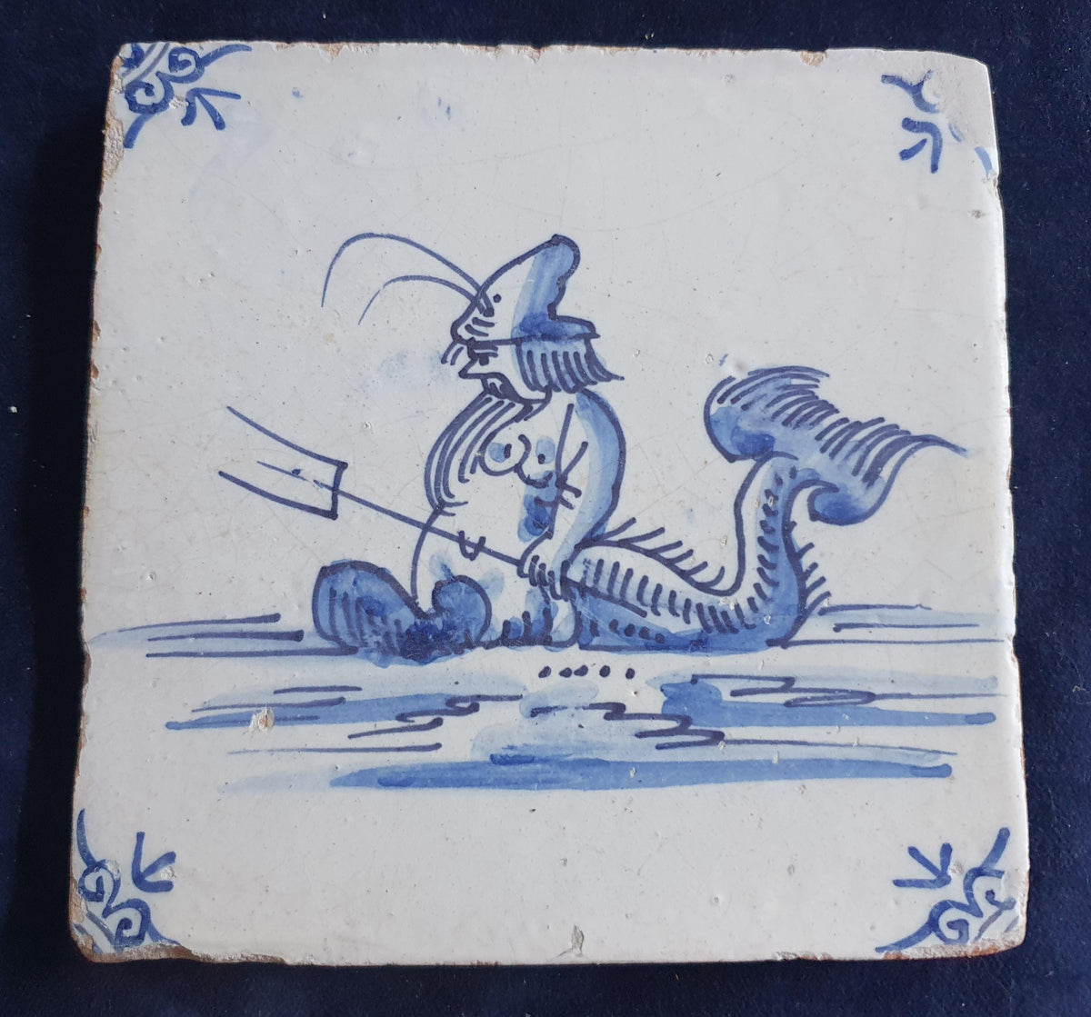 Delft tile with  a merman was produced around 1660 .  mythicaltile