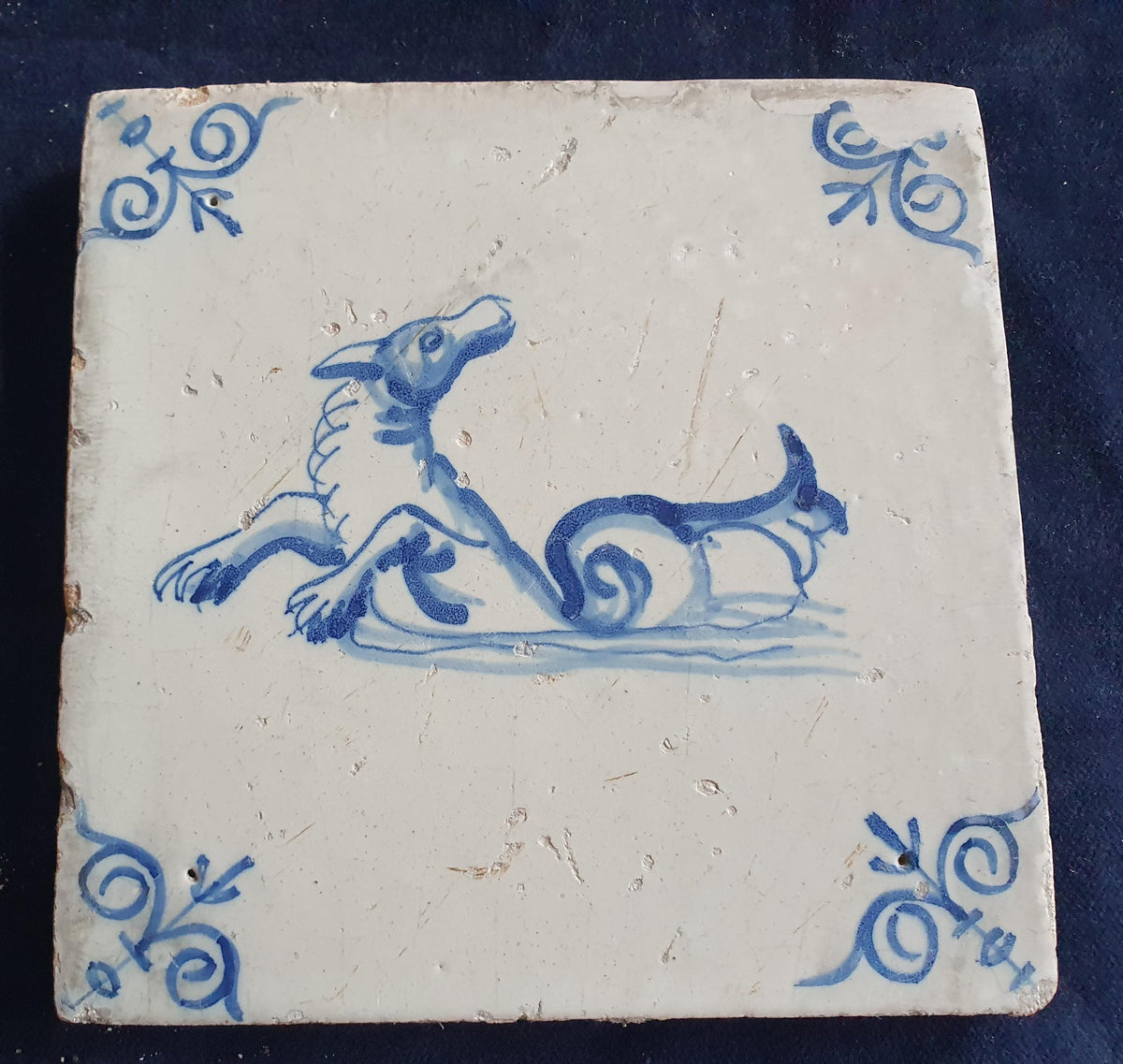 Antique Delft tile depicts a sea monster, around 1640 and made in Amsterdam .  mythicaltile