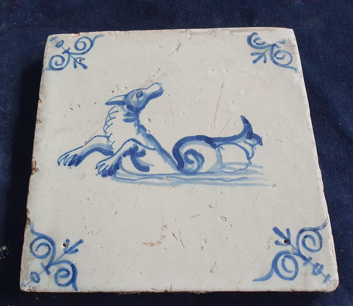 Antique Delft tile depicts a sea monster, around 1640 and made in Amsterdam .  mythicaltile