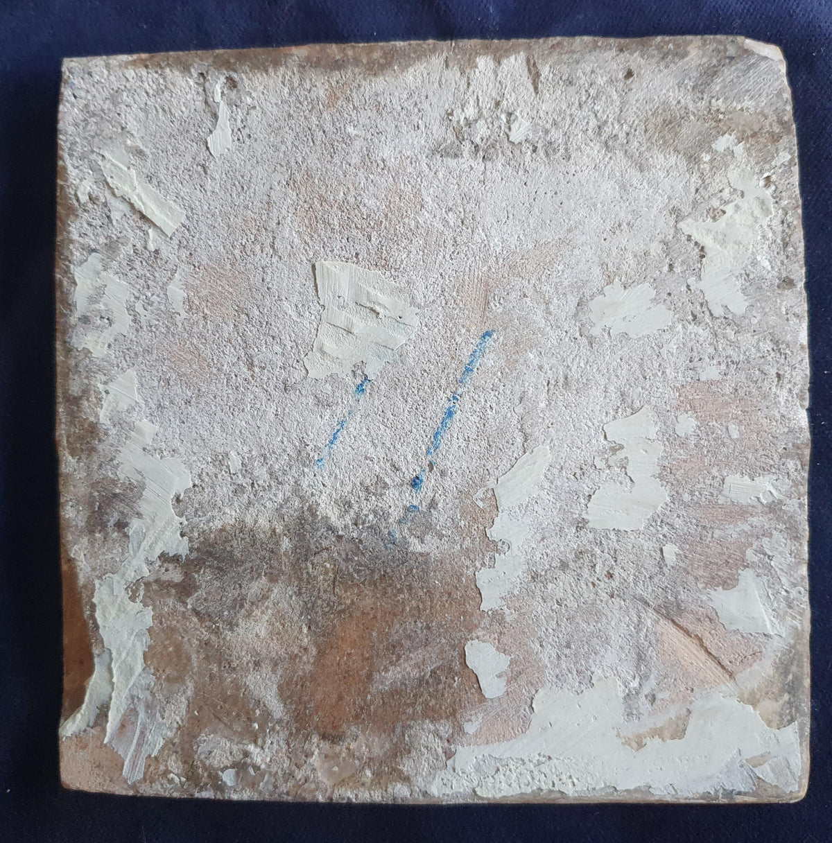 Antique Delft tile dating from around 1650, featuring a beautifully painted depiction of a fully rigged warship at sea. Shiptile