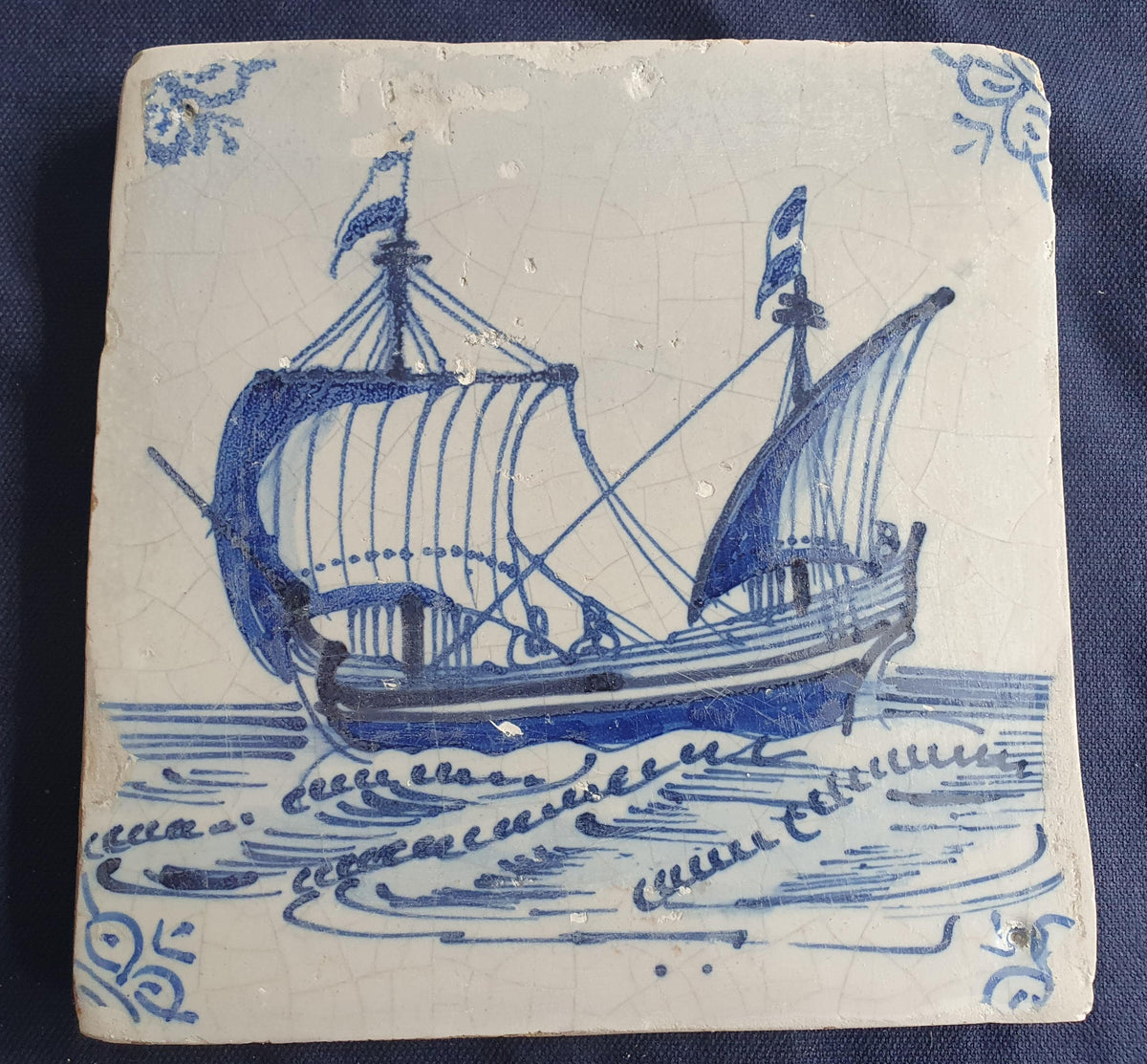 Delft tile, dating from circa 1660, is painted in blue and depicts a ship sailing to the left with its sails fully hoisted. Shiptile