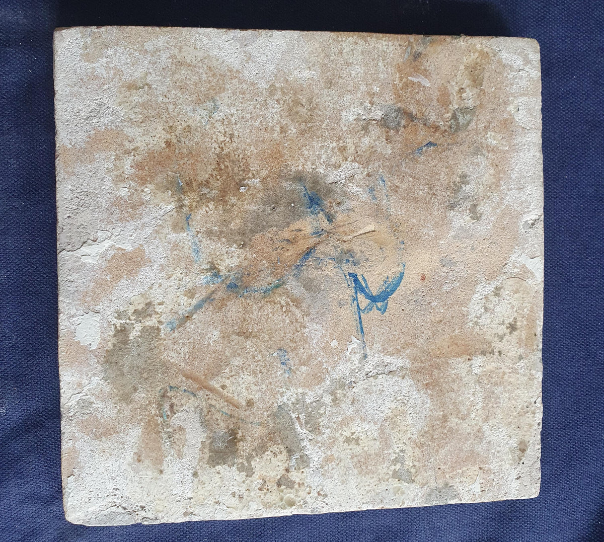 Delft tile, dating from circa 1660, is painted in blue and depicts a ship sailing. Shiptile