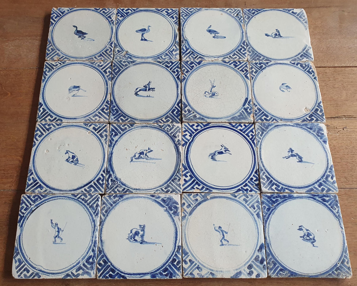 Sixteen antique Delft tiles feature designs within a circle.    Animaltile Wall tiles.