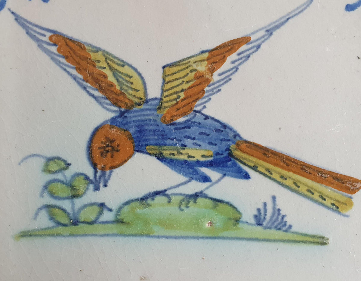 Delft tile depicting a colorful bird in flight, around 1640.  Animaltile
