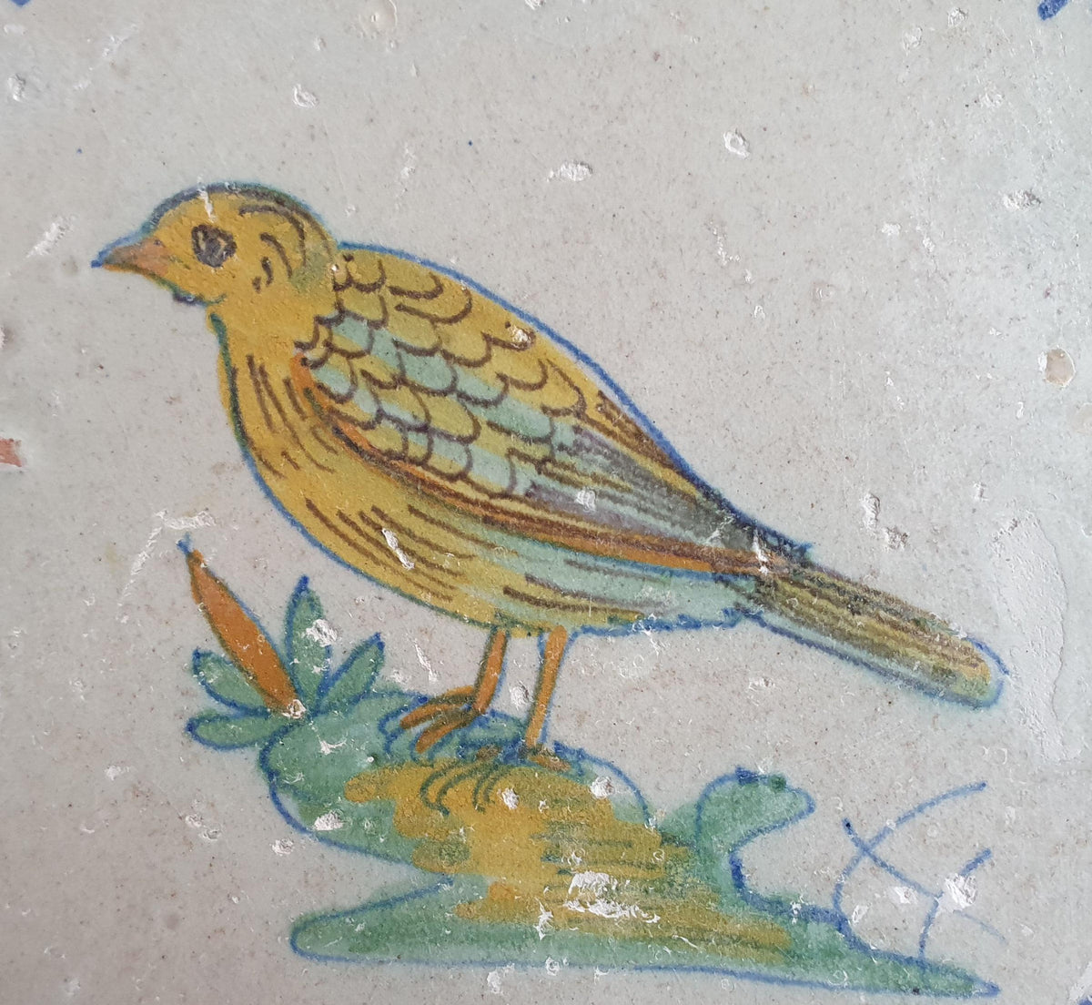 Delft tile depicting a colorful bird , around 1640.  Animaltile