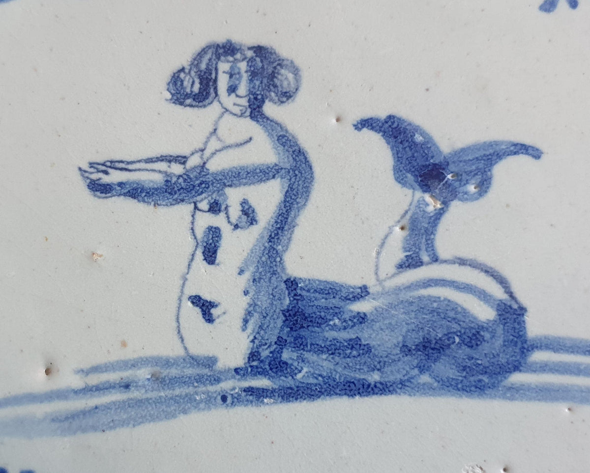 Delft tile with  a merman was produced around 1660 .  mythicaltile