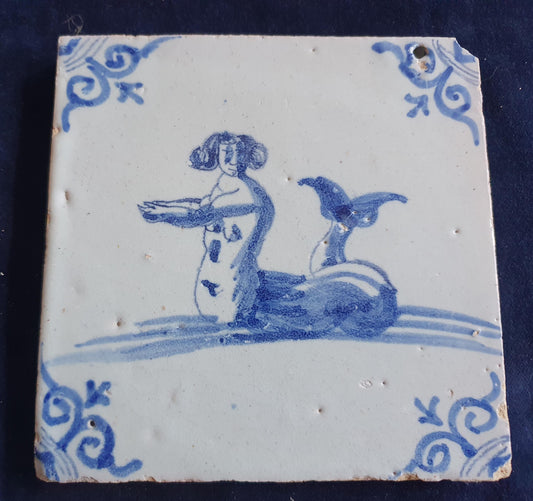 Delft tile with  a merman was produced around 1660 .  mythicaltile