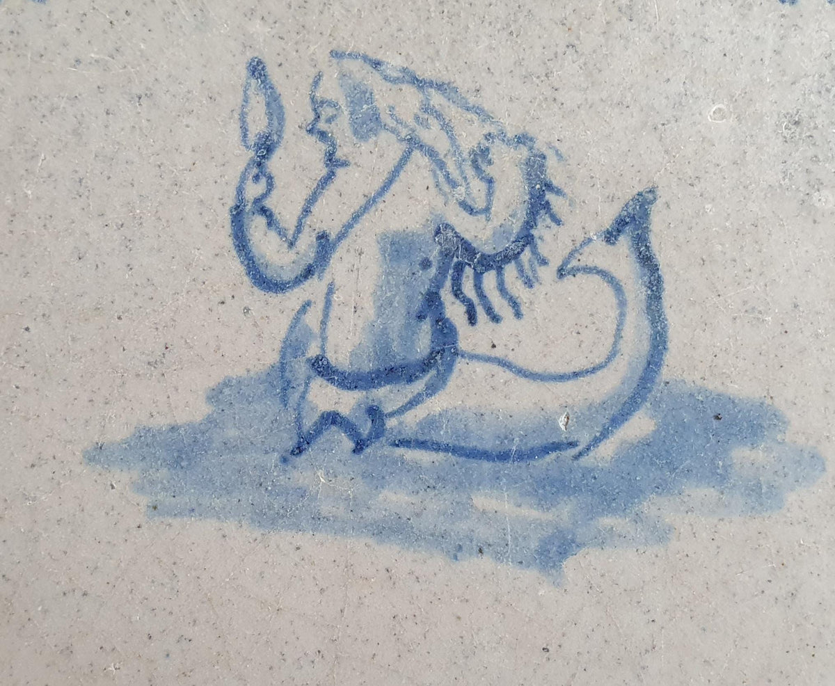 Delft tile with  a merman was produced around 1640 .  mythicaltile