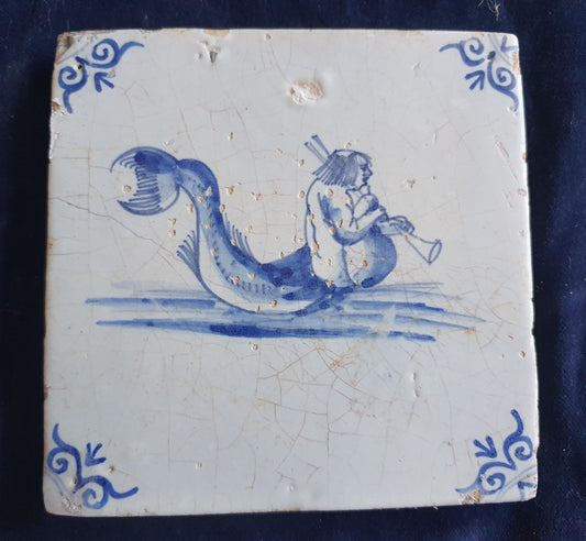 Delft tile with  a merman was produced around 1660 .  mythicaltile