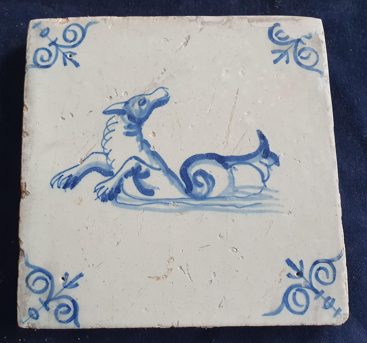 Antique Delft tile depicts a sea monster, around 1640 and made in Amsterdam .  mythicaltile
